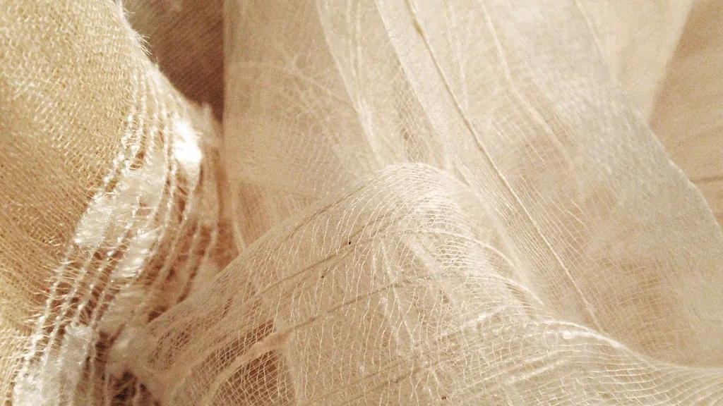 Textura de tejido claro en pliegues suaves